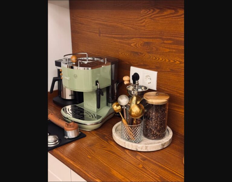A dedicated coffee corner with an espresso machine and matching ceramics.