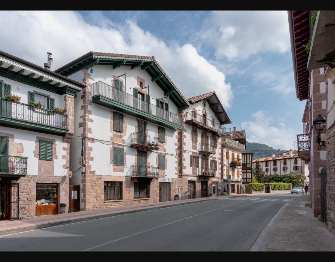 A quiet residential street, reflecting the local, settled-in pace of slow travel.