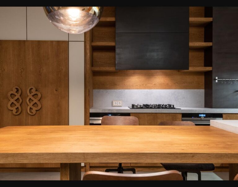 Warm walnut-toned kitchen cabinetry, reflecting the shift toward richer wood tones in kitchen design.